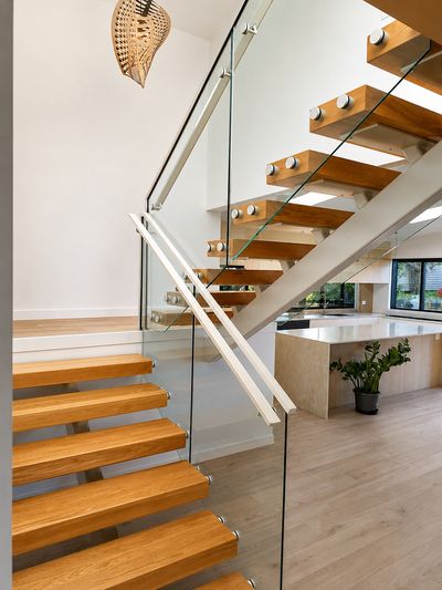 Frameless glass balustrade on a floating timber staircase