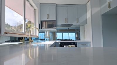 Mirror splashback in a kitchen