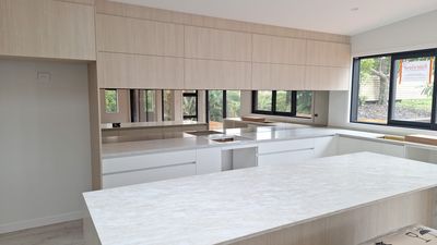 Mirror splashback in a kitchen, second example