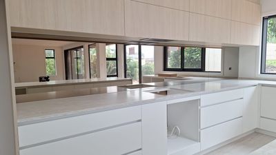 Mirror splashback in a kitchen, third example