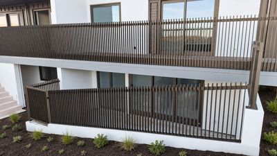 Postless architectural aluminium balustrade on a deck, Whangamata