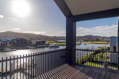 Postless architectural aluminium balustrade on a waterfront balcony, Whitianga